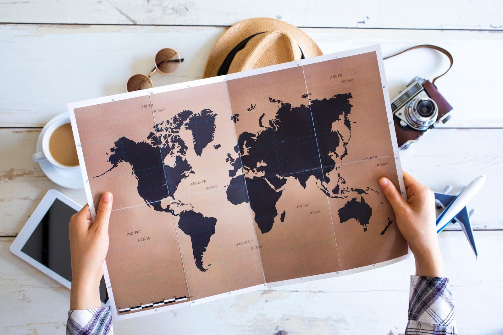 a person holding a world map