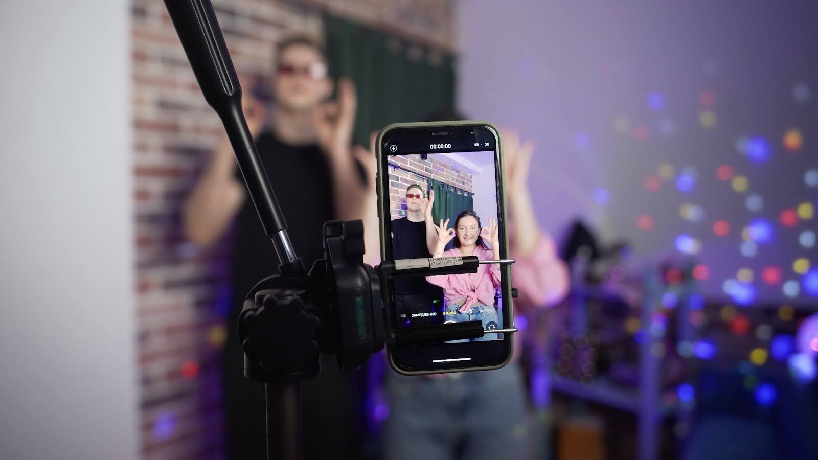 a guy and a girl recording a video
