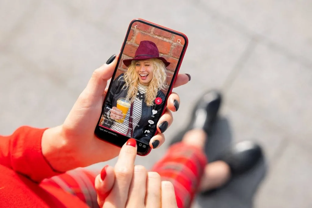 a woman watching a tiktok video