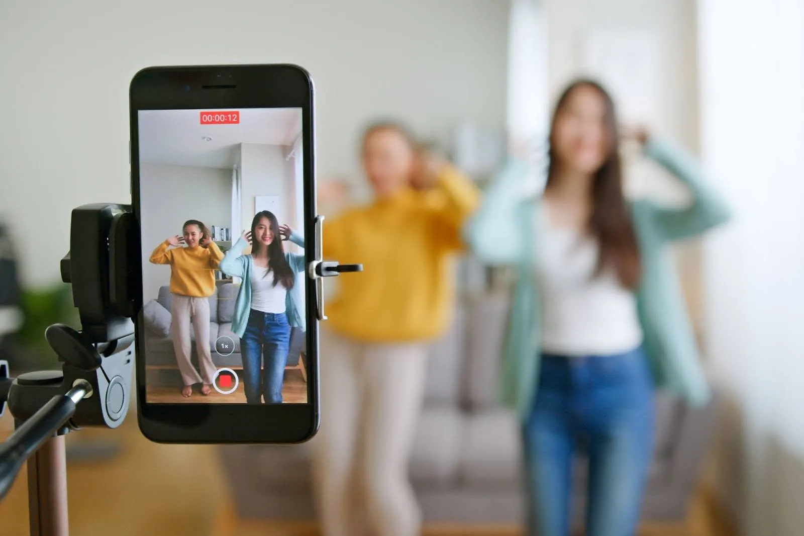 two girls recording a TikTok video