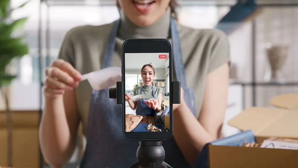 a woman recording a video for tiktok